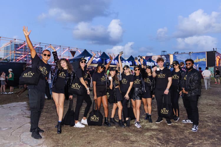 staff photo of a team of people at a festival