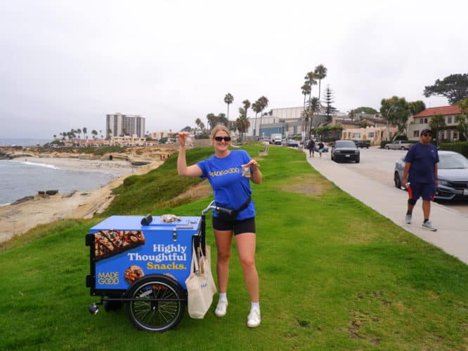 woman on blue trike with snack samples