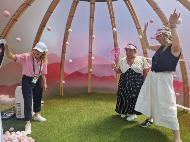 women celebrating in a tent