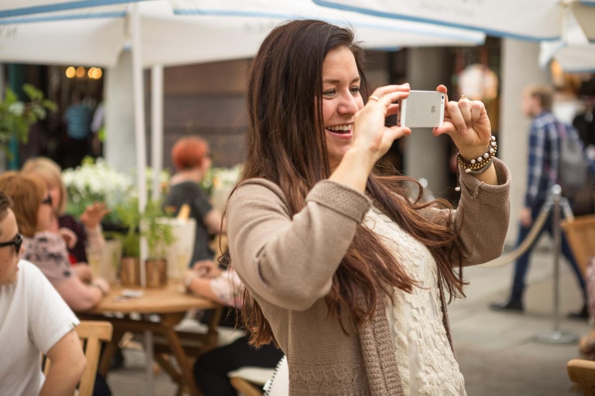 Person taking photo with phone