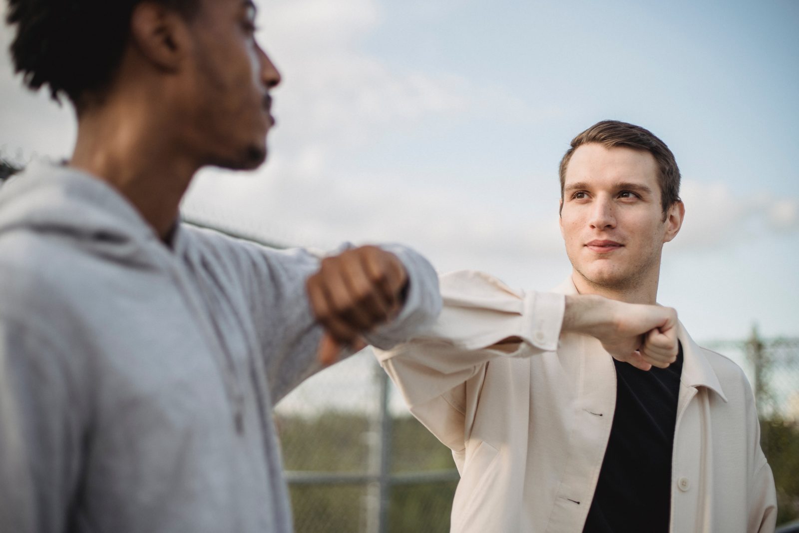 Two people socially distancing